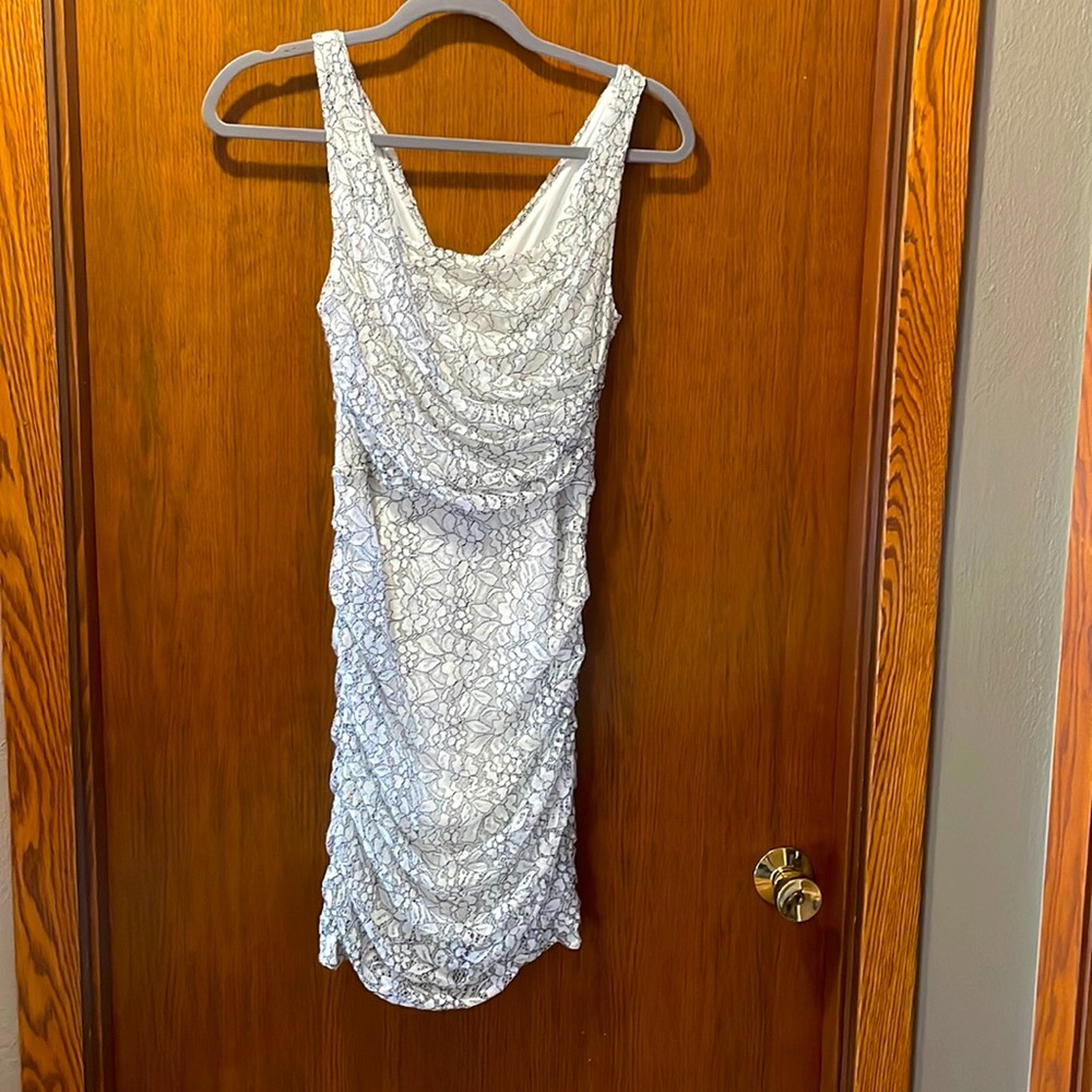 Fitted white and black lace mini dress